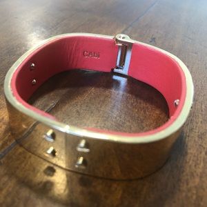 Cabi gold and orange leather hinged cuff bracelet.